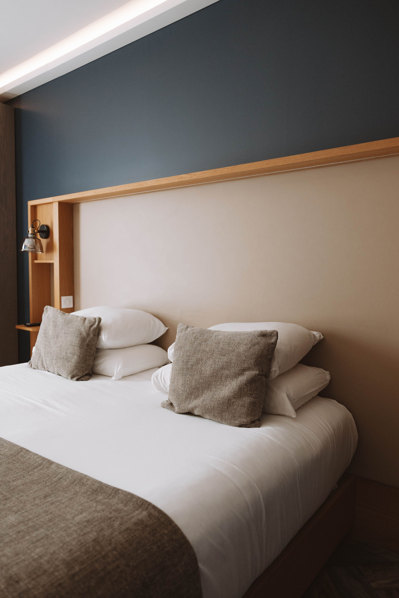 Warmly lit, well-presented bedroom in a home suited to professional short-let management